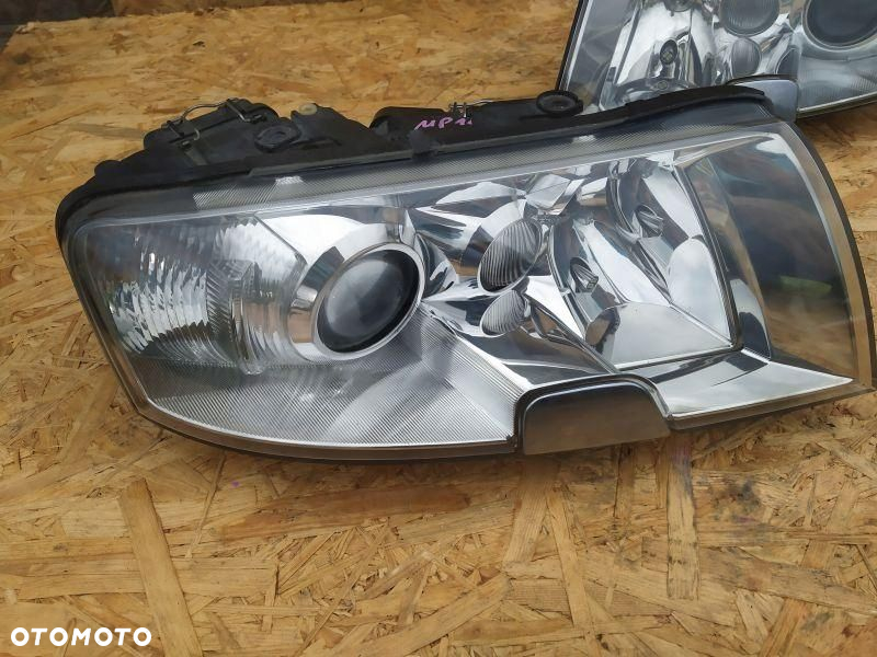 REFLEKTOR LAMPA PRAWA + LEWA EUROPA KSENON SKODA SUPERB I 1 - 2