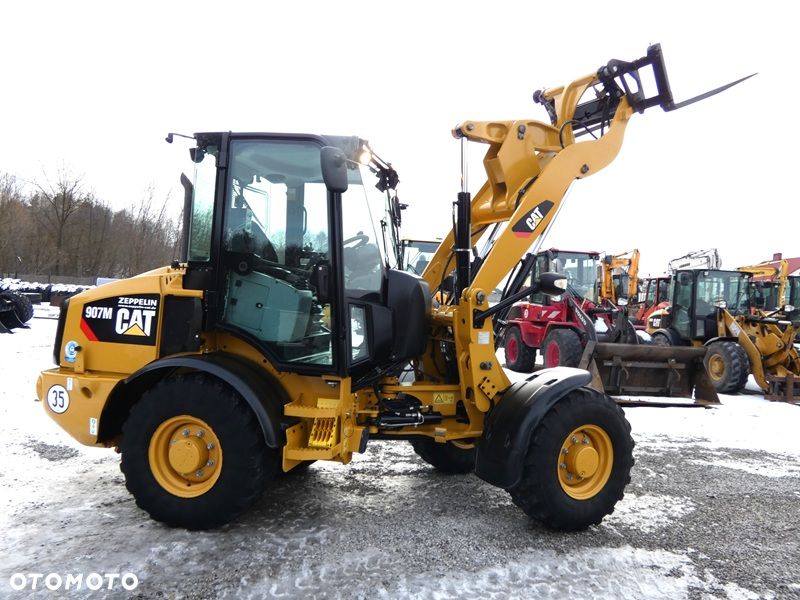 Caterpillar CAT 907M Z Niemiec / Wyjątkowo Wyposażony / 35km/h / 3.050mtg / - 38