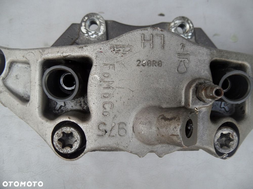 ZACISK HAMULCOWY LEWY PRZÓD VOLVO V40 II 975 - 4