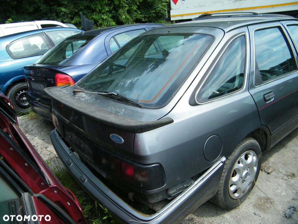 Ford Sierra (91-93r.) 2.0B 115KM. Silnik N9E Skrzynia A4LD lakier Polaris Grey. Cały na części GWARANCJA !!!  Przód Tył Zestaw Komplet Drzwi Klapa Zderzak Błotnik Maska Grill Atrapa Szyba Pas Lampa Lusterko Boczki Fotel Kanapa Kokpit Deska Rozdzielcza Przełącznik Włącznik Sterownik Przewody Wiązka Instalacja Moduł Komputer Czujnik Listwa Pompa Alternator Wtryski Głowica Rozrusznik Kompresor Sprzęgło Dwumas Silnik Skrzynia ABS Klimatyzacji Paliwa Wspomagania Kolektor Turbina Przepustnica Zawór Chłodnica Koło Hak Belka Sanki Zawieszenie Mcpherson Półoś Amortyzator Wydech Tłumik Zacisk Most - 6