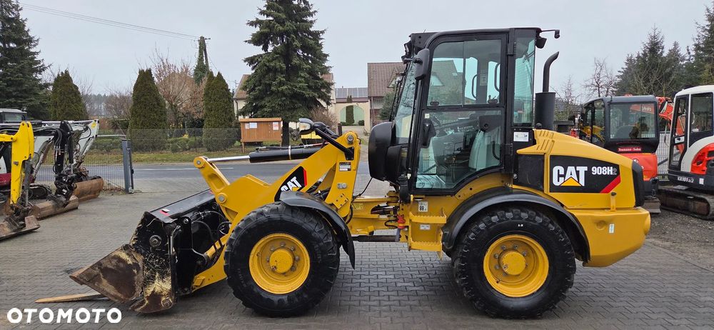 Caterpillar 908H2 2014 rok 5400Mtg łyżka dzielona, widły z Niemiec!