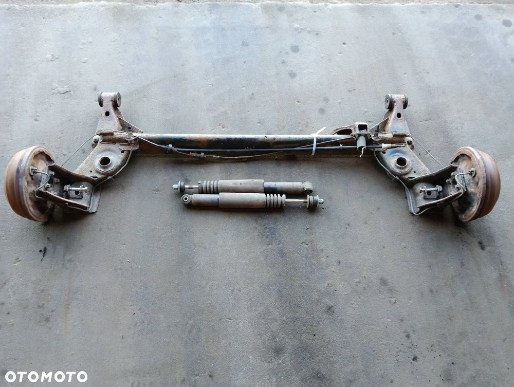 BELKA OŚ ZAWIESZENIA TYŁ BĘBNY BEZ ABS OPEL CORSA B - 1