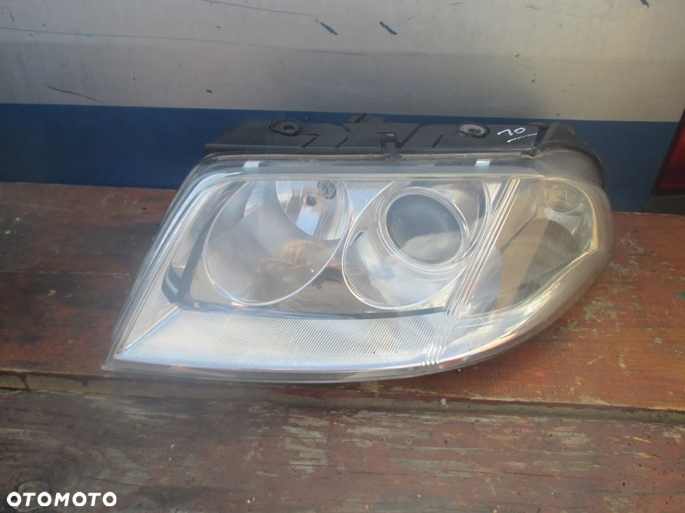Lampa lewa VW PASSAT B5 LIFT HELLA EUROPA - 1