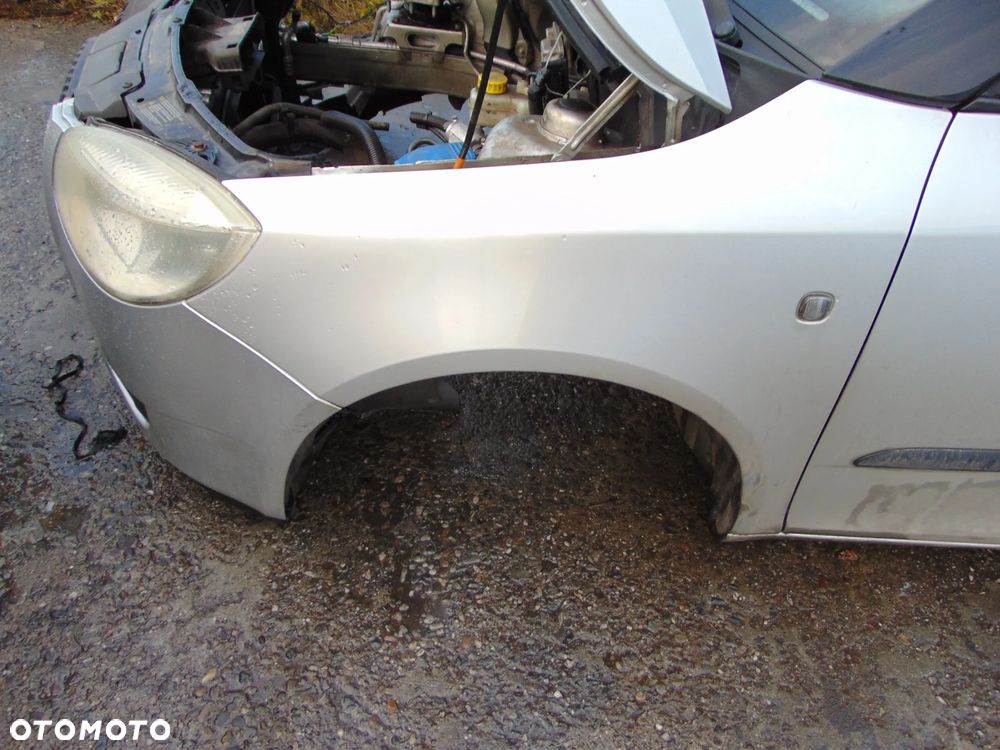 BŁOTNIK LEWY PRZÓD PRZEDNI SKODA FABIA II 9102 - 1