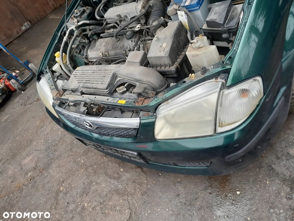 Mazda 323 323f 323  BJ 98-03  Maska lampa zderzak atrapa w kolor 18J - 11