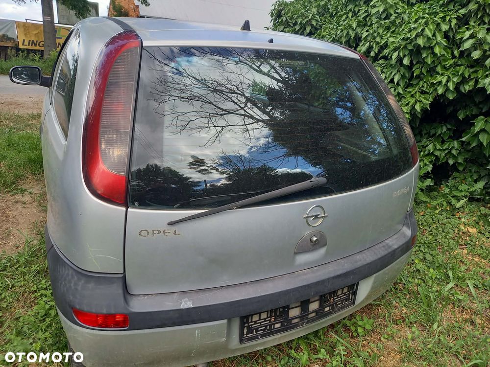 części OPEL CORSA C hatchback 3drzwi 1.0 benzyna 2002r. Srebrny LAMPY tył prawa lewa - 2