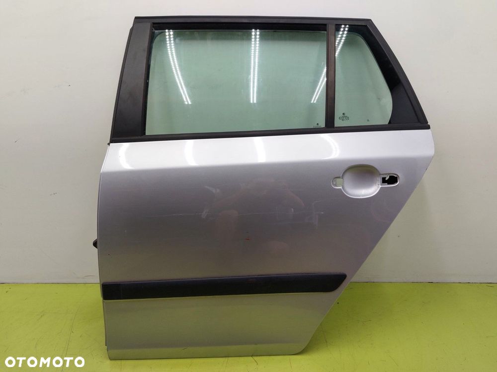 Drzwi tylne lewe tył SKODA FABIA II 2 LIFT 2010-2014 KOMBI LA7W SREBRNE - 1