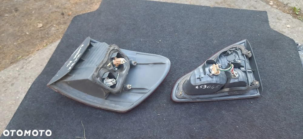 Toyota Avensis Verso 1 clm20l Lakier 1c0  Maska błotnik drzwi  Reflektor lampa przód tył - 16