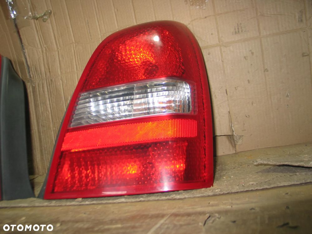 lampa tyl prawa lewa nissan primera P12 sedan oryginal - 9