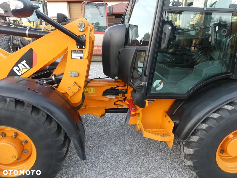 Caterpillar CAT 906H / Z Niemiec / 6424mtg / - 26