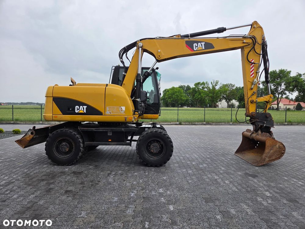 Caterpillar M313D / spr. ze Szwajcarii / - 5