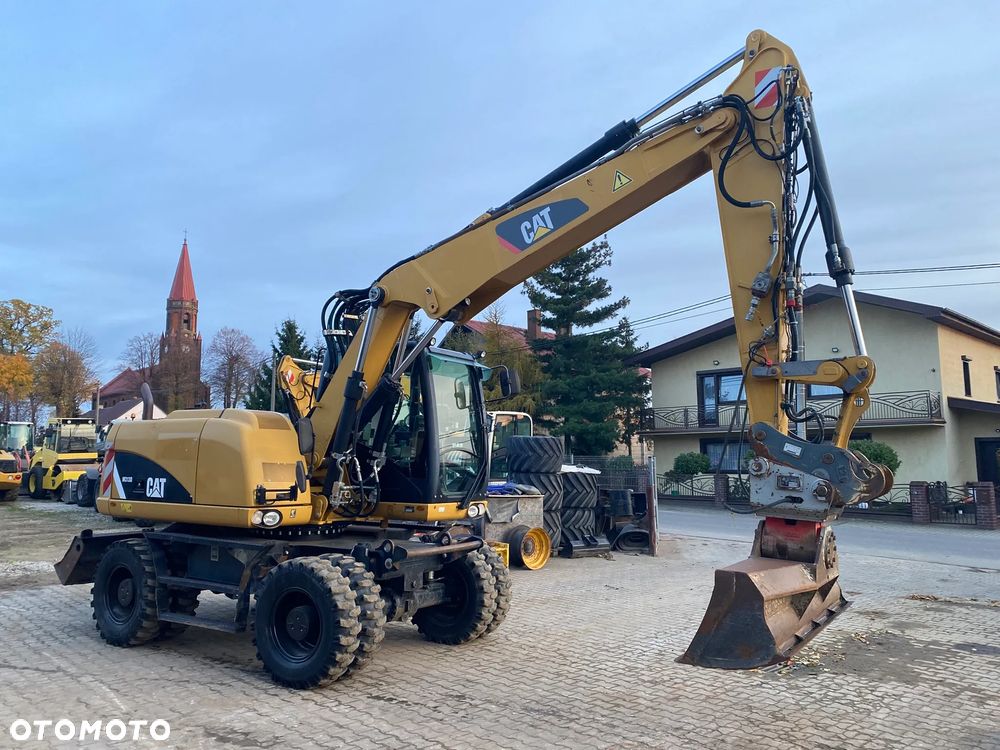 Caterpillar CAT M313D, 7500 MTH, 2015 ROK, Z NIEMIEC, - 2
