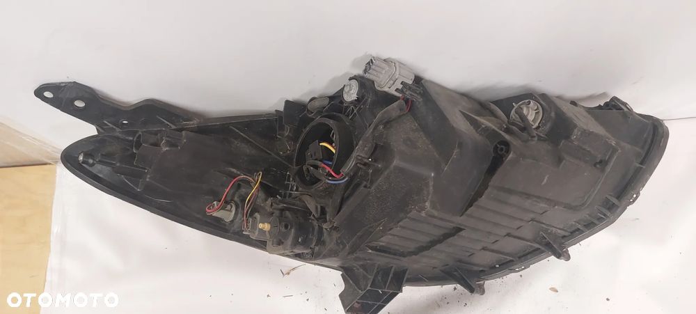 .  PRZOD PRZEDNIA LAMPA LEWA MAZDA 2 - 3