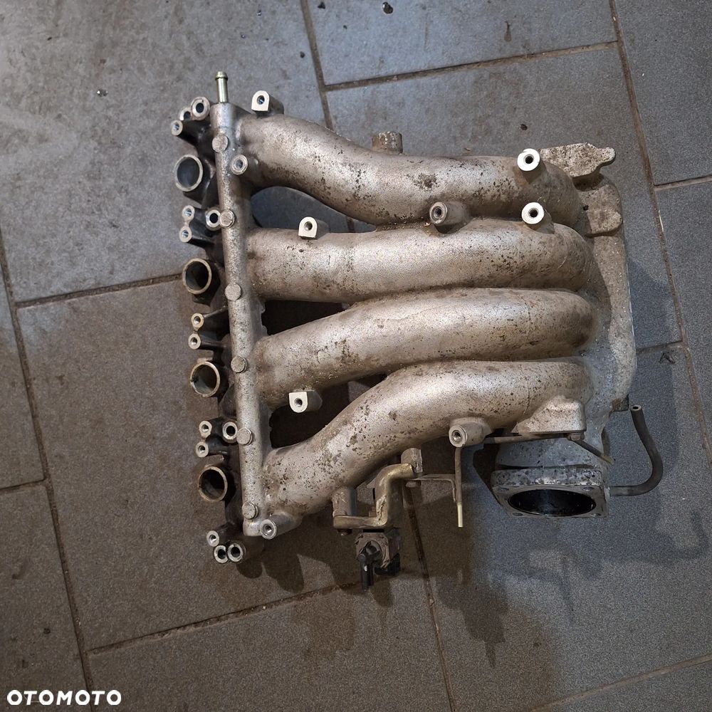 KOLEKTOR SSACY CARISMA 1.8 GDI - 2