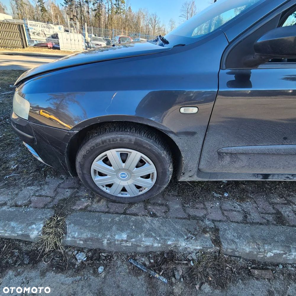 Fiat Stilo 1,6 B 76 kW / 103 KM (2003 kombi) (kod lak: 675) pojazd na części: maska, zderzak, drzwi, szyby, lusterka, chłodnica ... - 10