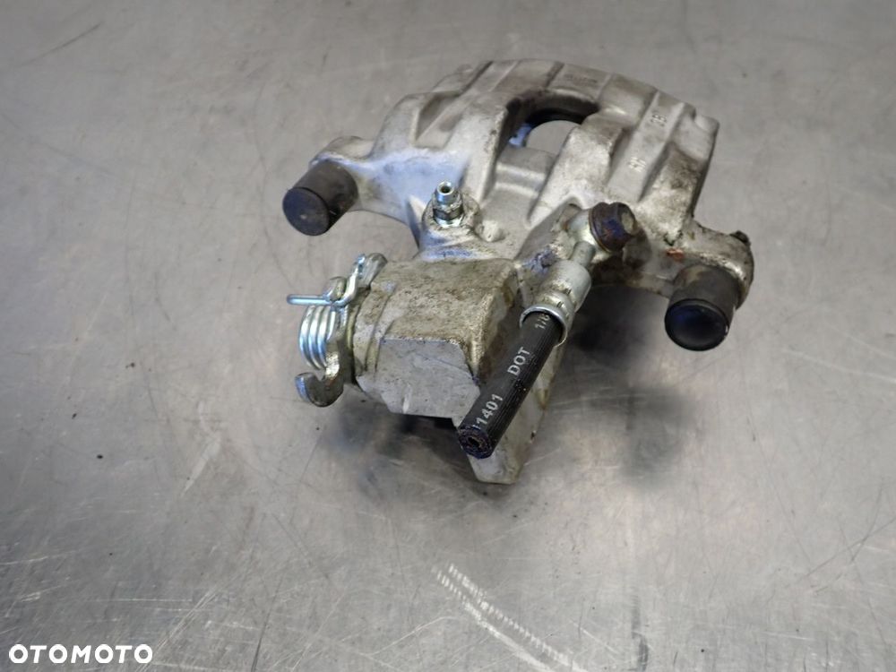 ZACISK HAMULCA PRAWY TYŁ NISSAN ALMERA 2.2 4B2118R - 2