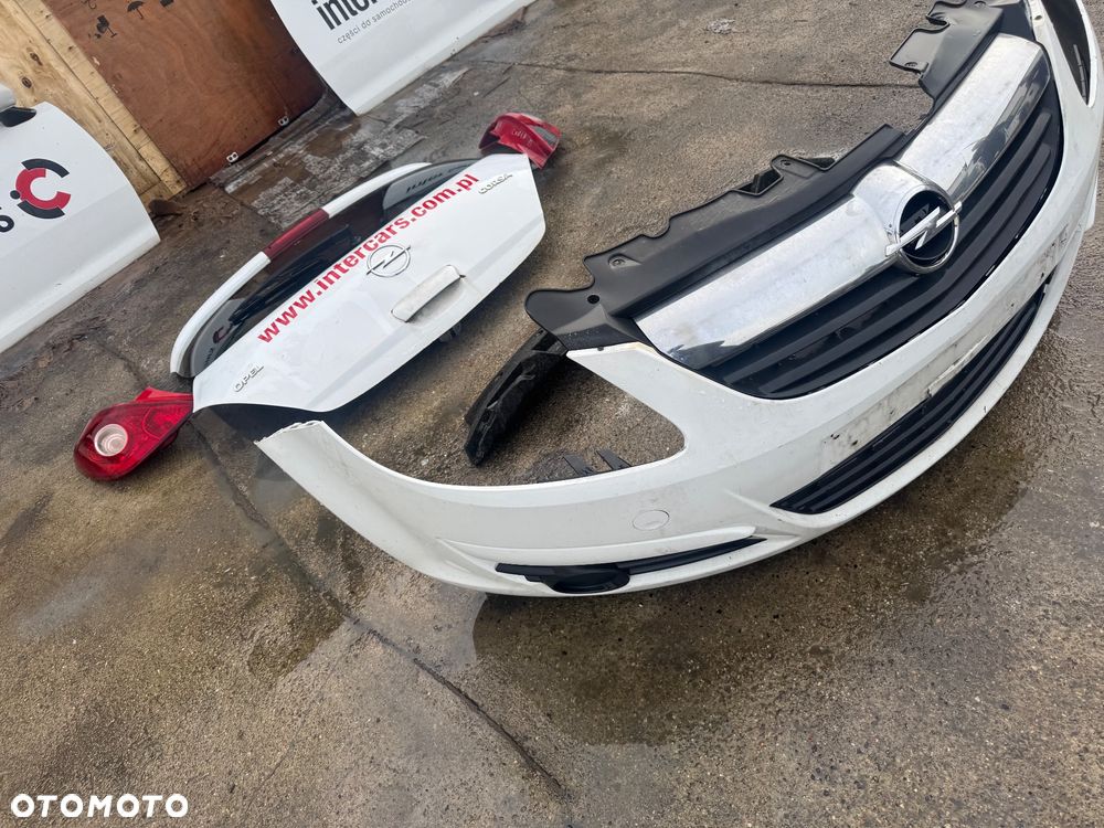 Opel Corsa D biała maska drzwi prawe lewe przednie przód pas przedni chłodnice wody klimy lampy lampa przednia prawa lewa błotnik prawy lewy biały białe zderzak przód przedni klapa bagażnika klapa tył tylnia lampa prawa lewa belka pod zderzak - 9