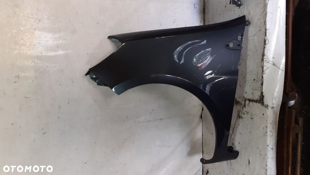 *RENAULT CLIO III 185 BŁOTNIK PRZEDNI LEWY - 1