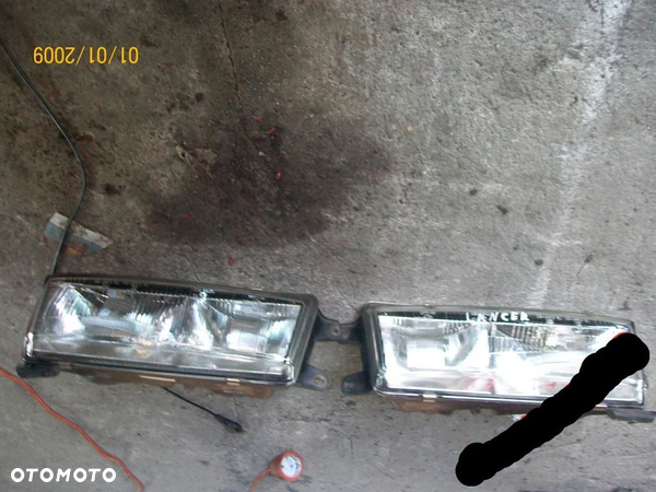 LAMPA LEWA MITSUBISHI LANCER COLT EUROPA ORYGINAŁ