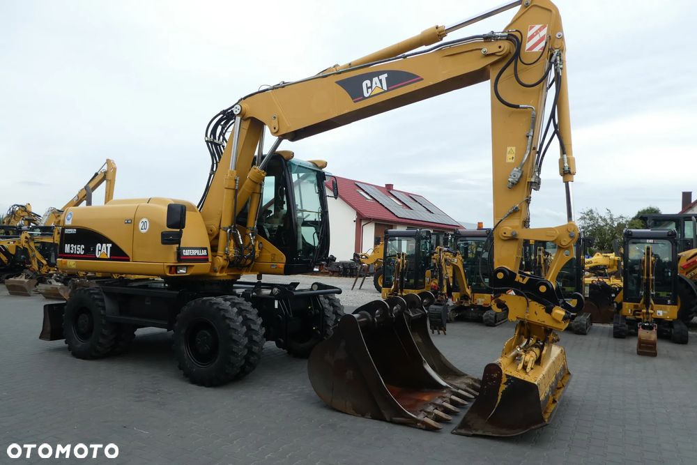 Caterpillar M315C Z NIEMIEC TRZY ŁYZKI - 7