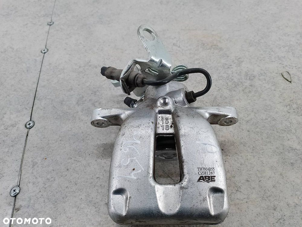 ZACISK HAMULCOWY PRAWY TYŁ VW GOLF V TH793 CZH1267 ABE 1.4 TSI - 2