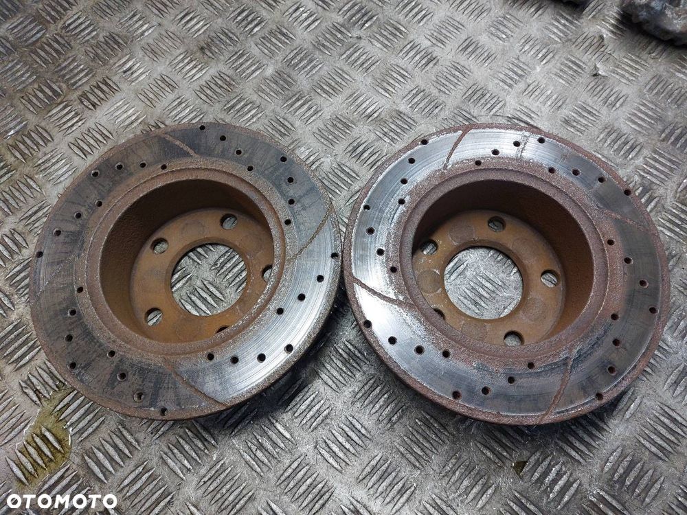 TARCZE HAMULCOWE TYŁ + ZACISKI VOLKSWAGEN PASSAT B5 - 4