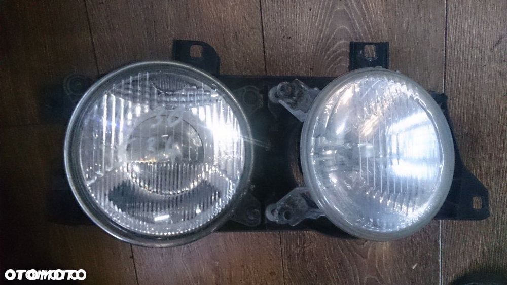 REFLEKTOR BMW E34 KPL HELLA PRAWY - 1