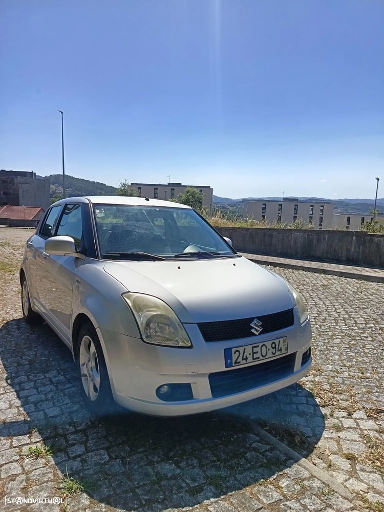 Suzuki Swift 1.3 DDiS GLX - 1