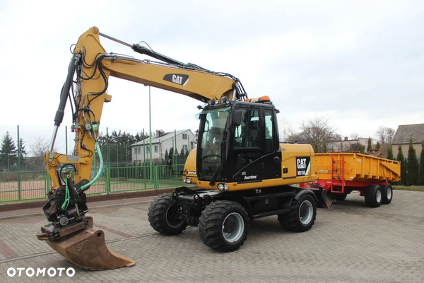 Caterpillar M 313D ROTOTILT STEELWRIST SZCZYPCE PRZYCZEPA WYWROTKA