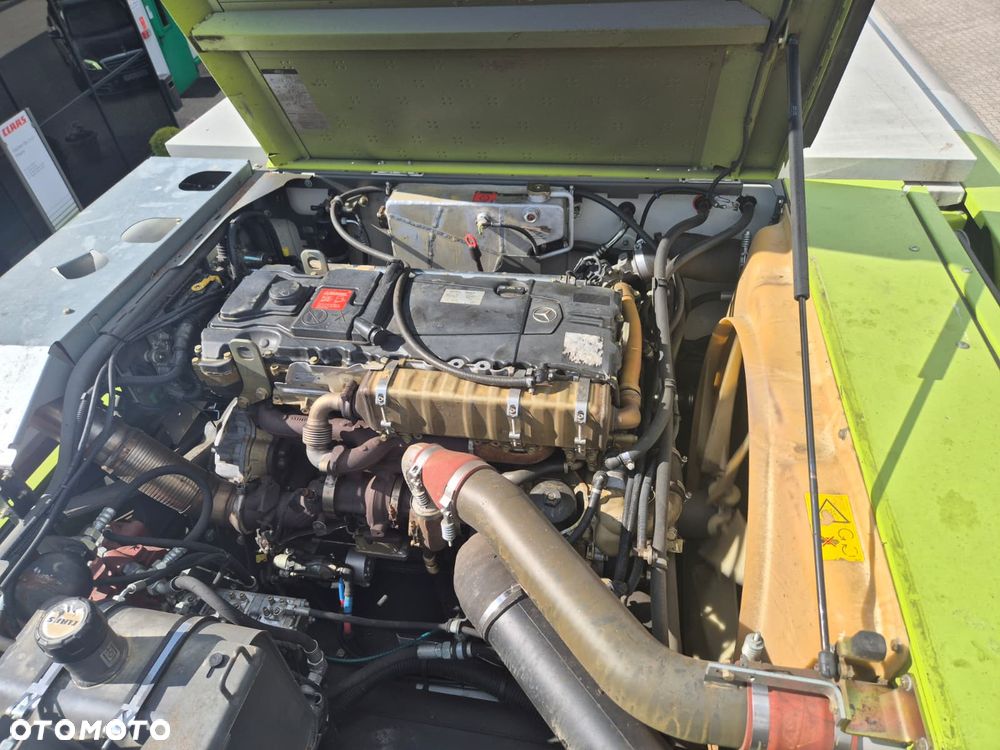 Claas Tucano 440 z hederem Vario 620 i przystawką do kukurydzy Olimac - 22