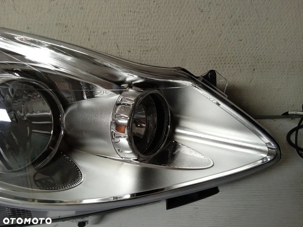 REFLEKTOR OPEL CORSA D LEWY LUB PRAWY NOWY - 9