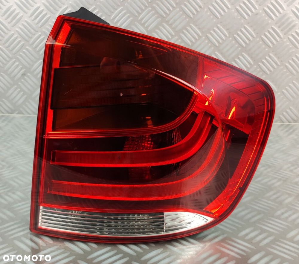 2990110 lampa prawa prawy tył tylna w błotnik BMW X1 E84 2009-2015 EUROPA - 2