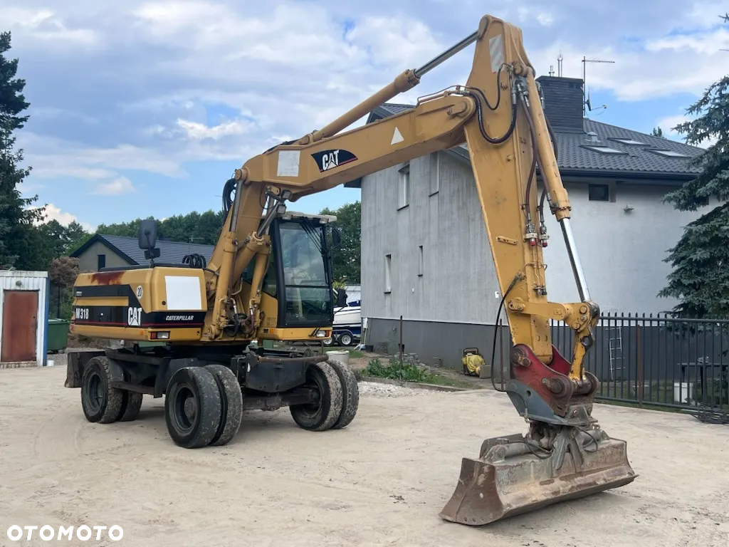 Caterpillar M318 - 4