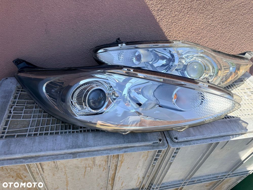 Lampa przednia FORD FIESTA MK7 SOCZEWKI KOMPLET EUROPA ORYGINALNE HELLA - 2