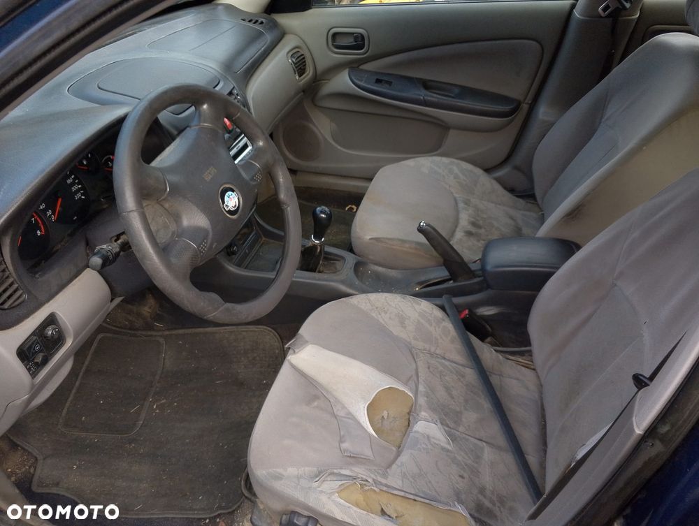 Nissan Almera N16 (00-02.) 1.5 B 89KM. Silnik QG15DE Skrzynia 4M40.Cały na części. GWARANCJA !!! Przód Tył Zestaw Komplet Drzwi Klapa Zderzak Błotnik Maska Grill Atrapa Szyba Pas Lampa Lusterko Boczki Fotel Kanapa Kokpit Deska Rozdzielcza Przełącznik Włącznik Sterownik Przewody Wiązka Instalacja Moduł Komputer Czujnik Listwa Pompa Alternator Wtryski Głowica Rozrusznik Kompresor Sprzęgło Dwumas Silnik Skrzynia ABS Klimatyzacji Paliwa Wspomagania Kolektor Turbina Przepustnica Zawór Chłodnica Koło Hak Belka Sanki Zawieszenie Mcpherson Półoś Amortyzator Wydech Tłumik Zacisk Most - 8