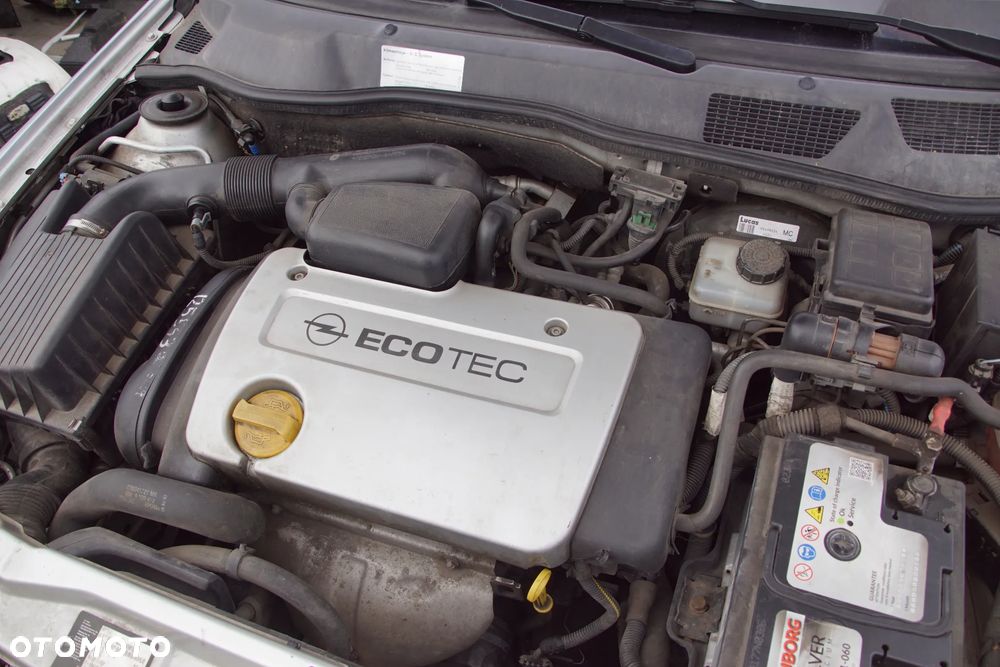 Auto na części - Opel Astra II G 1.6 16V 101 KM X16XEL F17 Z147 1999R Silnik Skrzynia Drzwi Maska Błotnik Zderzak Klapa Lampa Lusterko Klamka Szyba Deska Kokpit Sterownik Moduł Czujnik Licznik Panel Kierownica - 18
