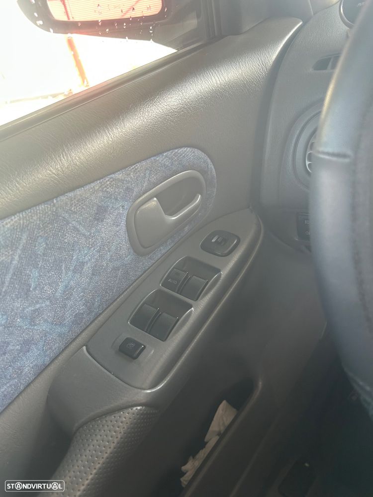 Mazda 323 1.3 - 6