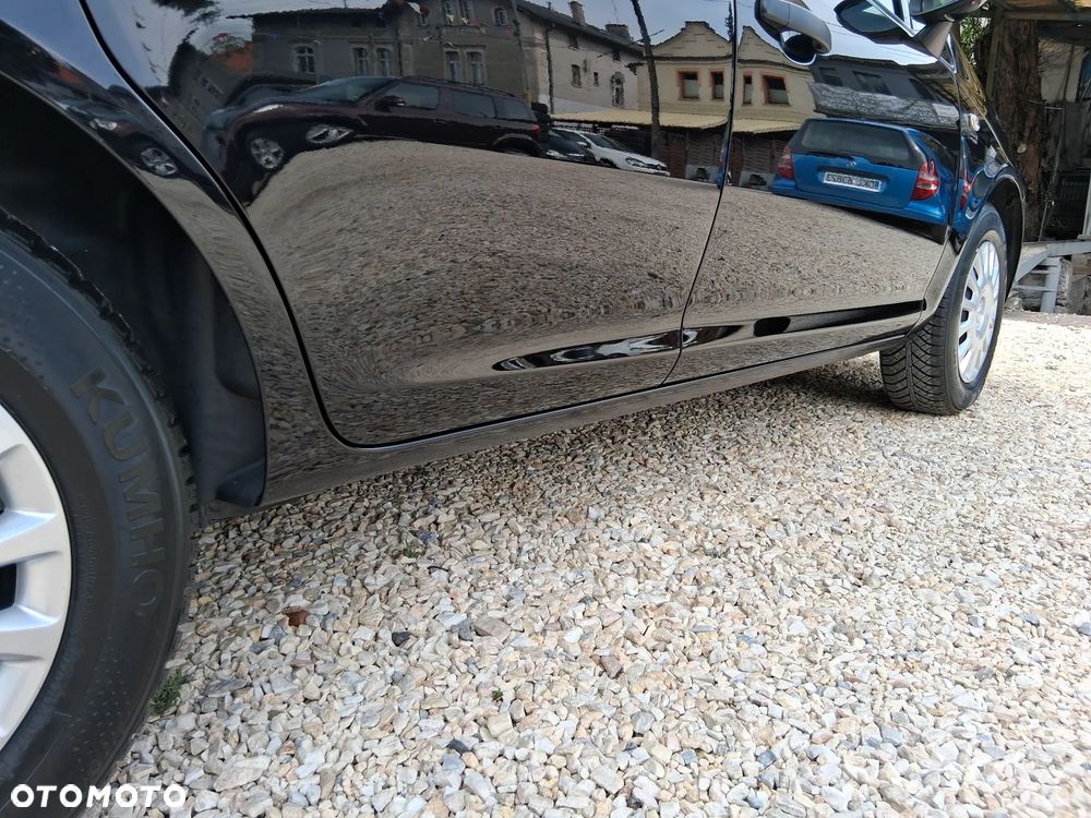 Opel Corsa 1.2 16V Enjoy - 23