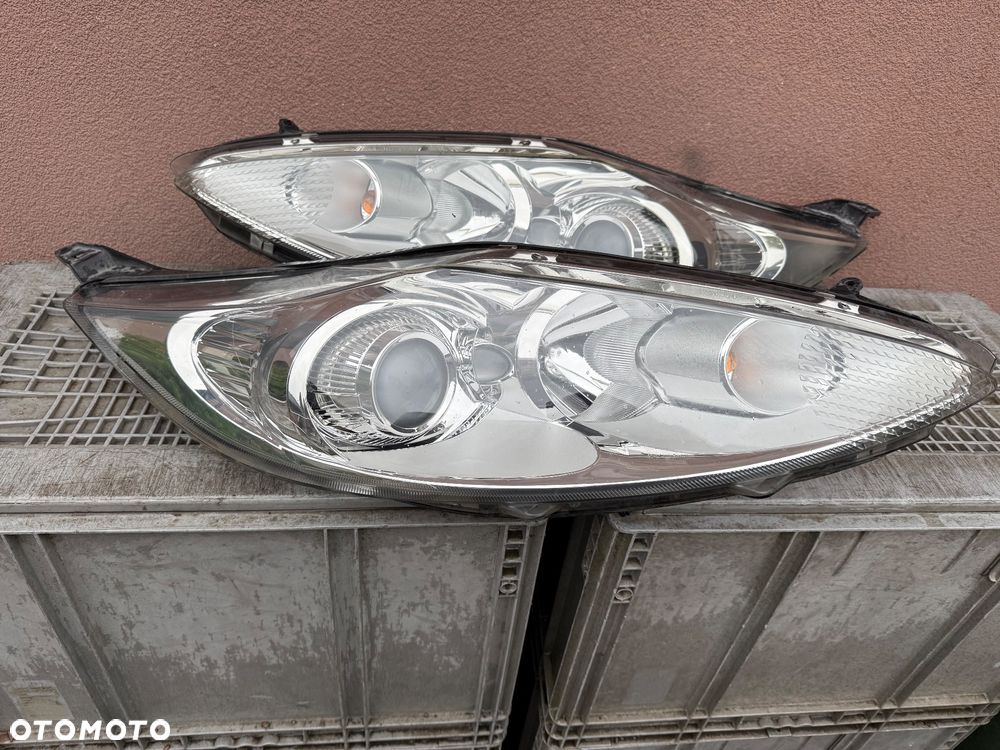 Lampa przednia FORD FIESTA MK7 SOCZEWKI KOMPLET EUROPA ORYGINALNE HELLA - 2