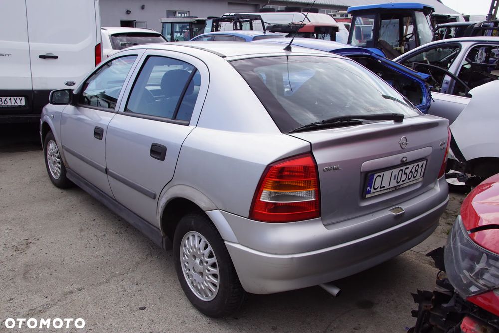 Auto na części - Opel Astra II G 1.6 16V 101 KM X16XEL F17 Z147 1999R Silnik Skrzynia Drzwi Maska Błotnik Zderzak Klapa Lampa Lusterko Klamka Szyba Deska Kokpit Sterownik Moduł Czujnik Licznik Panel Kierownica - 4