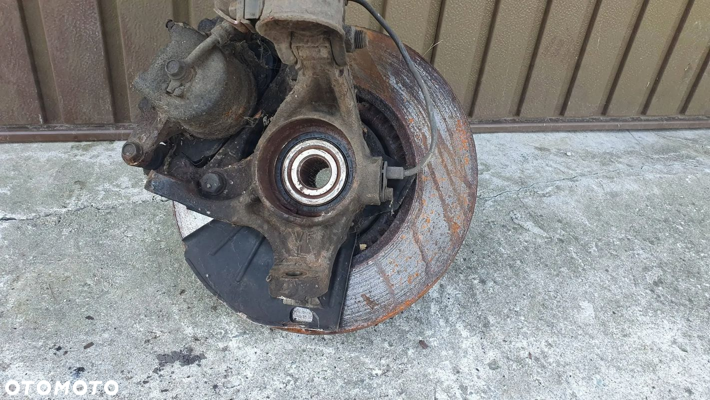 Hyundai i40 1.7 CRDI zwrotnica przód lewa kolumna mcpherson noga $ - 3