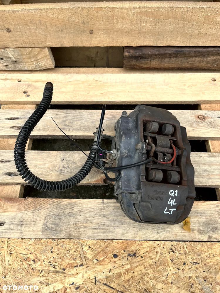 AUDI Q7 4L 3.0 TDI ZACISK HAMULCOWY LEWY TYŁ TYLNY BREMBO ORYGINAŁ