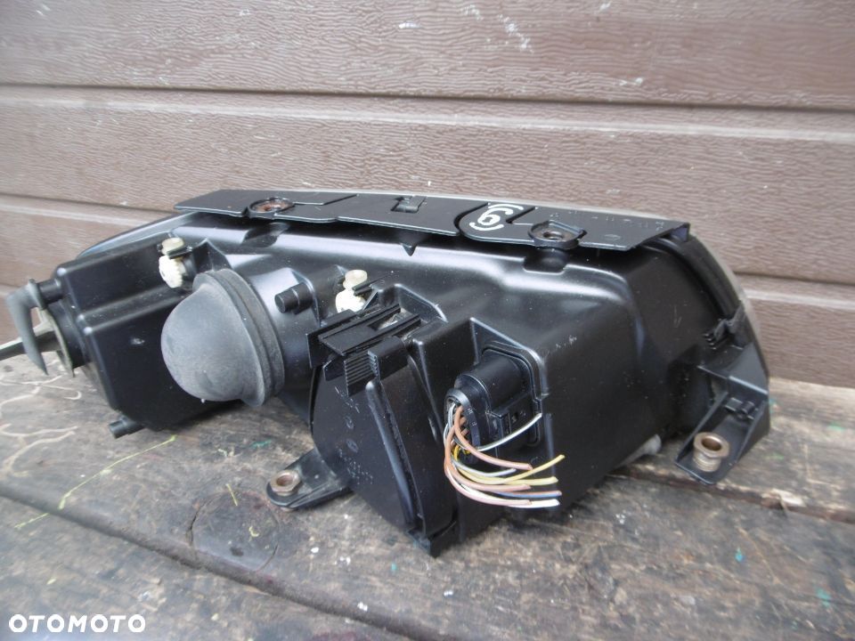 Lampa lewa VW PASSAT B5 LIFT HELLA EUROPA - 4