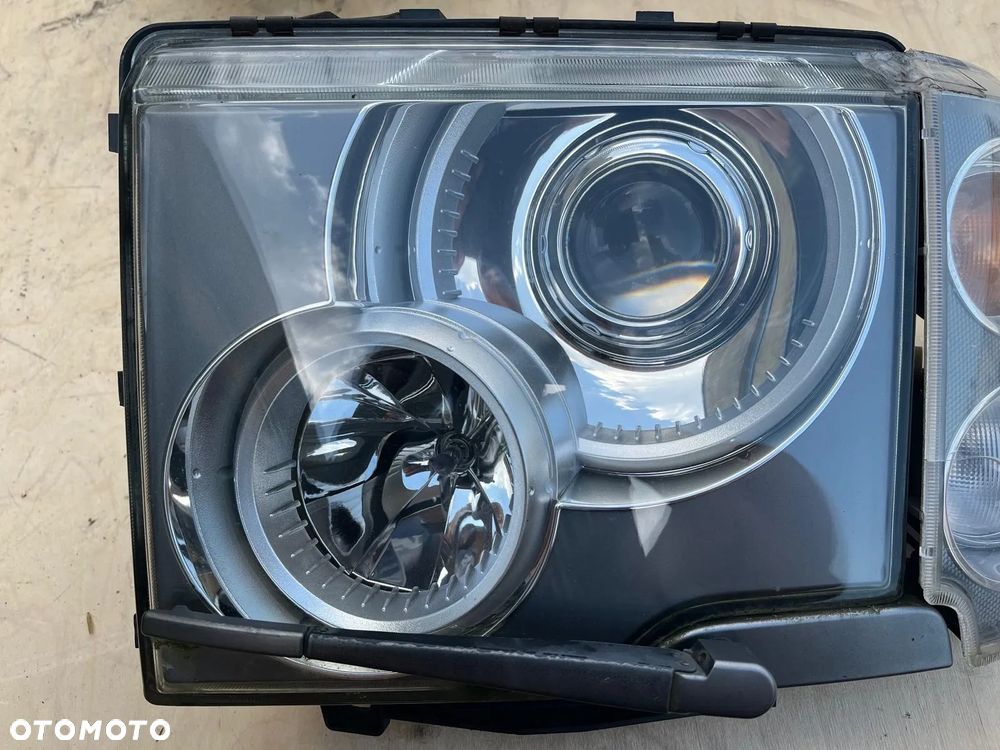 Lampa reflektor przód przednia lewa RHD anglik XBC000375 Range Rover L322 LM Vogue 2002-05 - 1