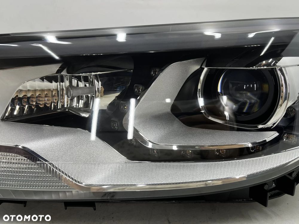 Lampa reflektor VW Tiguan 1 I 5n LIFT 10-16r. lewa przednia XENON EU skrętna doświetlanie zakrętów + - 5
