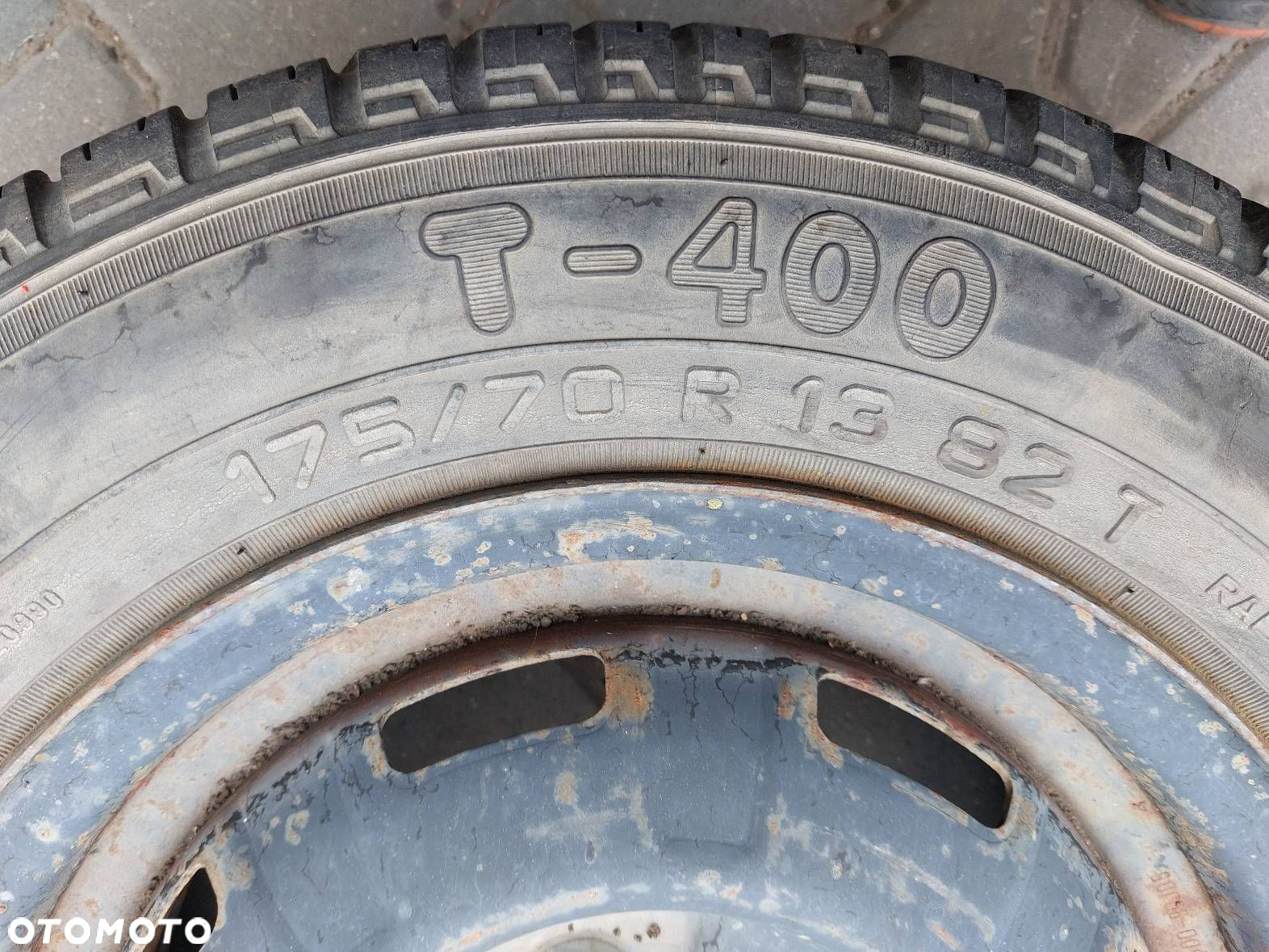 KOŁO FELGA OPONA 4x114,3 5Jx13 FI66,1 175/70R13 NISSAN 40300-90J05 - 3