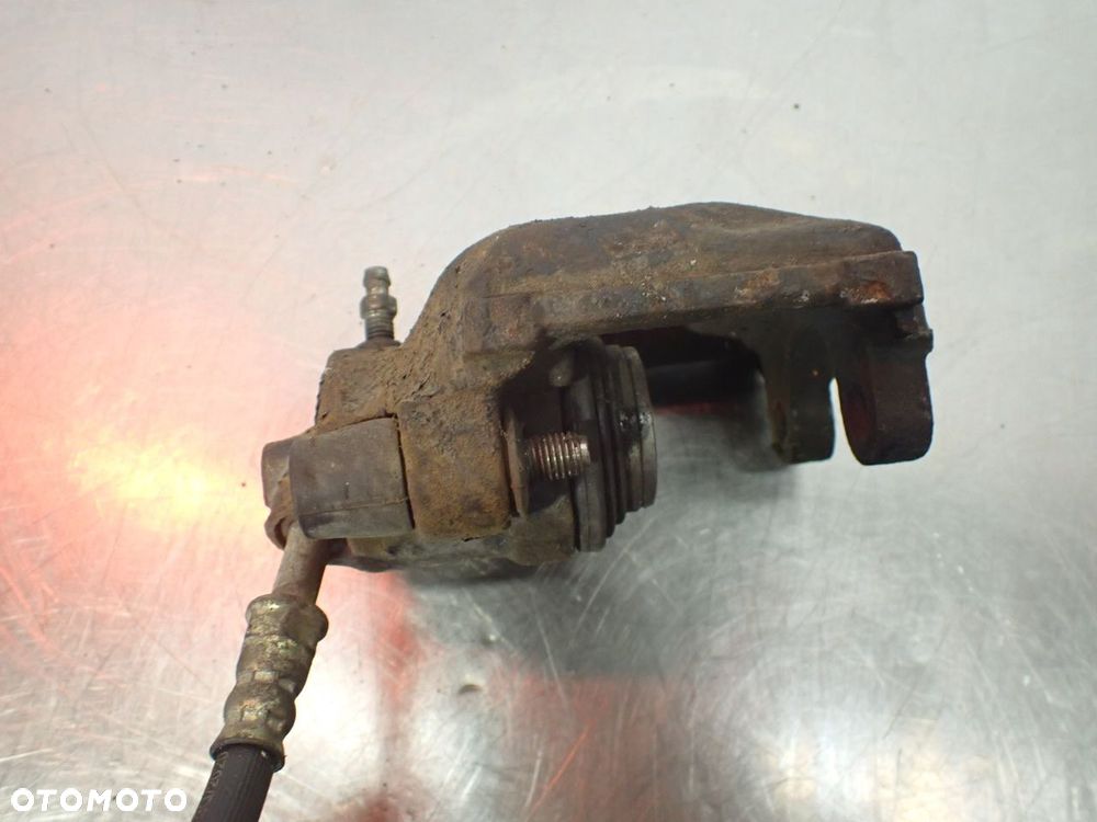 ZACISK HAMULCA PRAWY TYŁ BMW E36 - 4