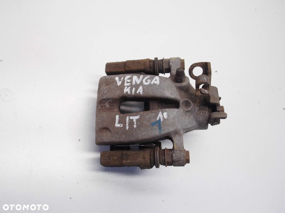 ZACISK HAMULCOWY KIA VENGA LEWY TYLNY ORYGINAŁ