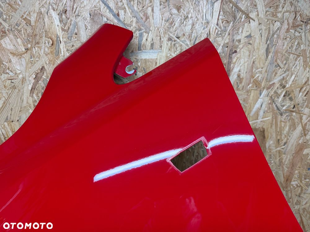 BŁOTNIK LEWY PRZÓD LEWY PRZEDNI OPEL CORSA E CZERWONY 50B - 23