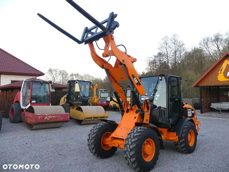 Caterpillar CAT 906H / Z Niemiec / 6424mtg / - 39